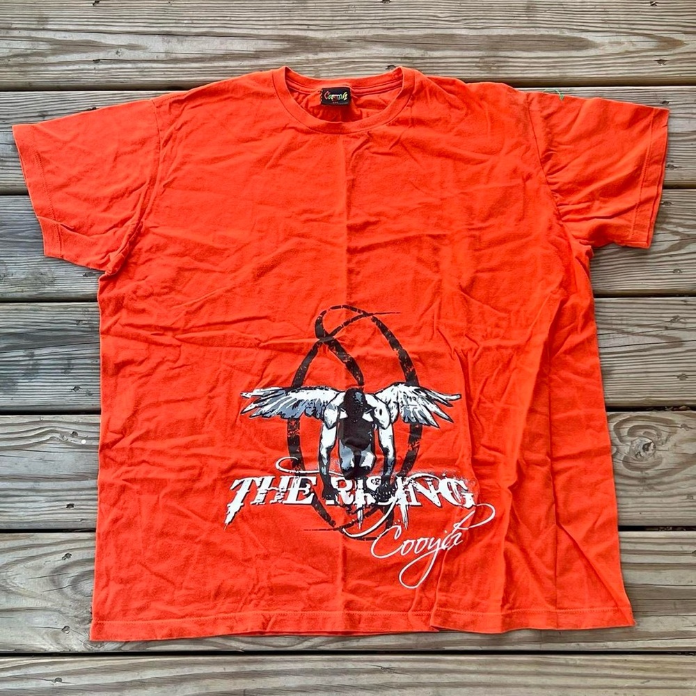 Vintage orange rising cooyah shirt.